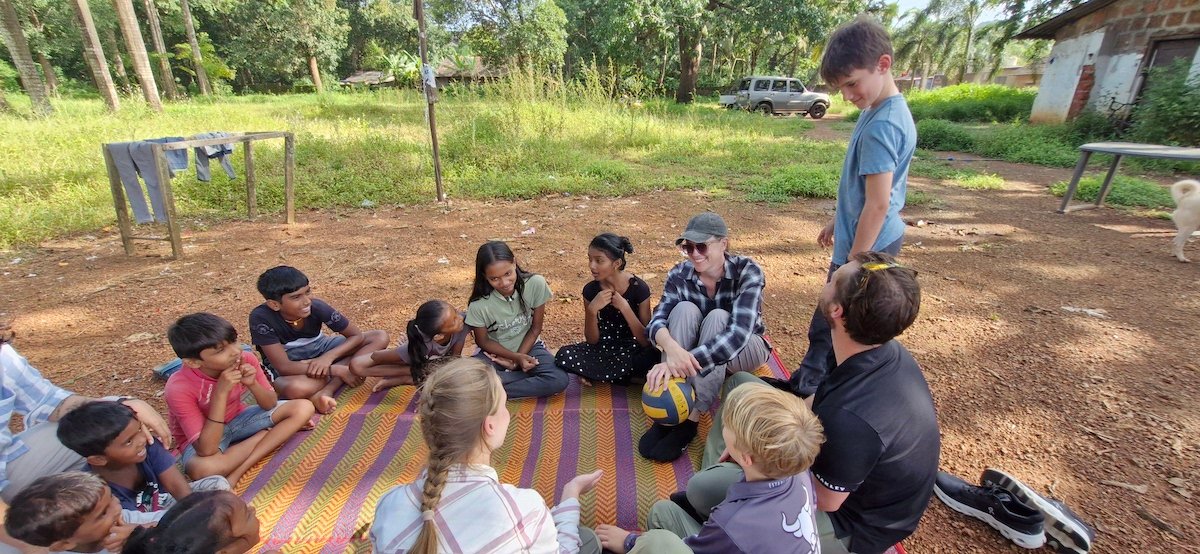 Family volunteering together during a volunteer vacation abroad.