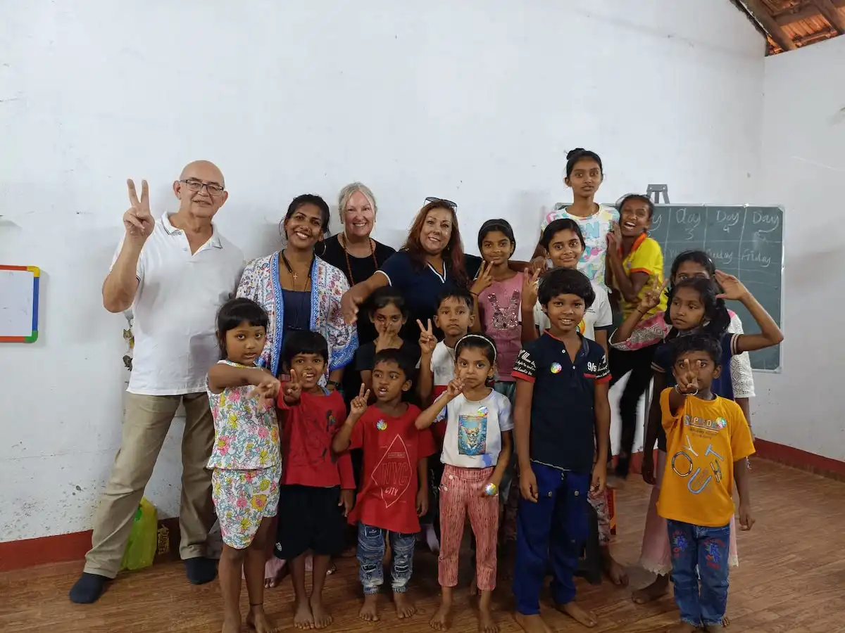 Family with teenagers volunteering together abroad during a volunteer vacation with private accommodation