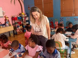 Best Volunteer Travel Companies for Families Worldwide Family volunteering together on a community project with local community members overseas