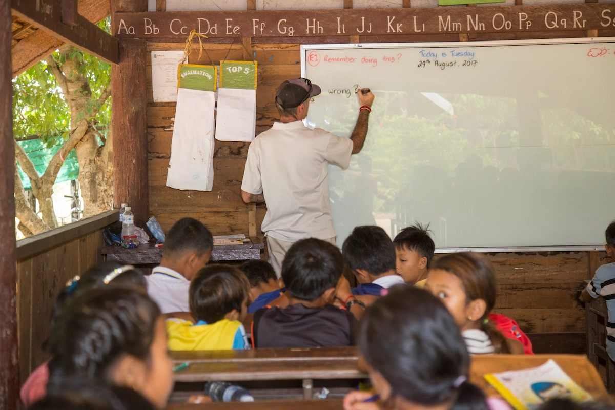 volunteer teaching english during luxury family volunteer program in cambodia